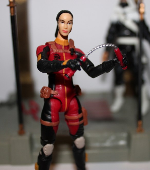 the blindfold is removable and the head underneath is based on, but not a copy of the VVV head. 